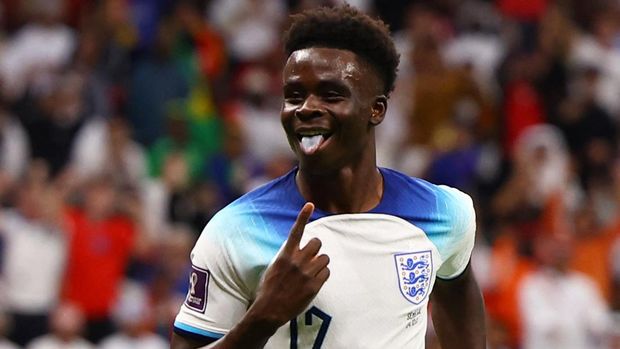 Soccer Football - FIFA World Cup Qatar 2022 - Round of 16 - England v Senegal - Al Bayt Stadium, Al Khor, Qatar - December 4, 2022 England's Bukayo Saka celebrates scoring their third goal REUTERS/Kai Pfaffenbach