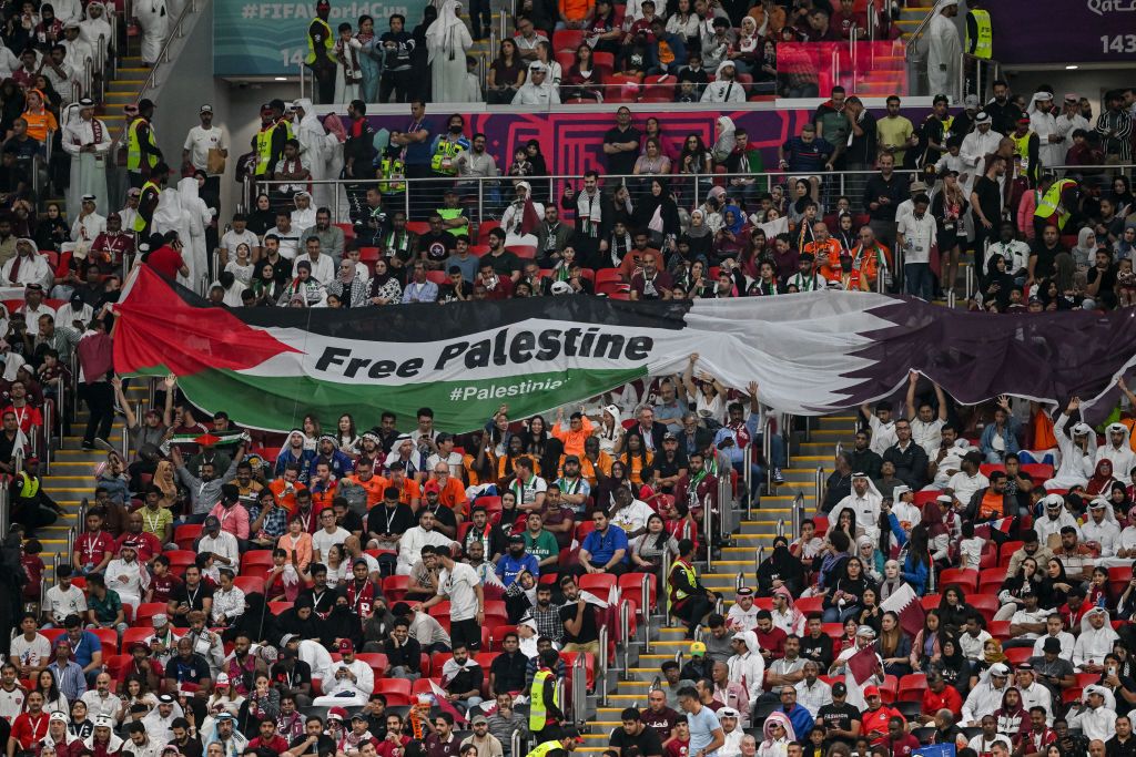 AL KHOR, QATAR - NOVEMBER 29: Spectators with flags, banners Free Palestine during the FIFA World Cup Qatar 2022 Group A match between Netherlands and Qatar at Al Bayt Stadium on November 29, 2022 in Al Khor, Qatar. (Photo by Harry Langer/DeFodi Images via Getty Images)