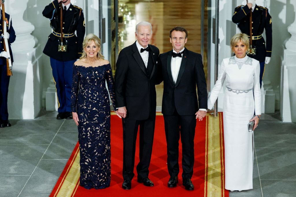 US President Joe Biden and First Lady Jill Biden greet French President Emmanuel Macron and his wife, Brigitte Macron, as they arrive for a State Dinner at the White House in Washington, DC, December 1, 2022. (Photo by Ludovic MARIN / AFP) (Photo by LUDOVIC MARIN/AFP via Getty Images)