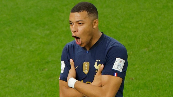 TOPSHOT - France's forward #10 Kylian Mbappe celebrates scoring his team's third goal during the Qatar 2022 World Cup round of 16 football match between France and Poland at the Al-Thumama Stadium in Doha on December 4, 2022. (Photo by Odd ANDERSEN / AFP) (Photo by ODD ANDERSEN/AFP via Getty Images)