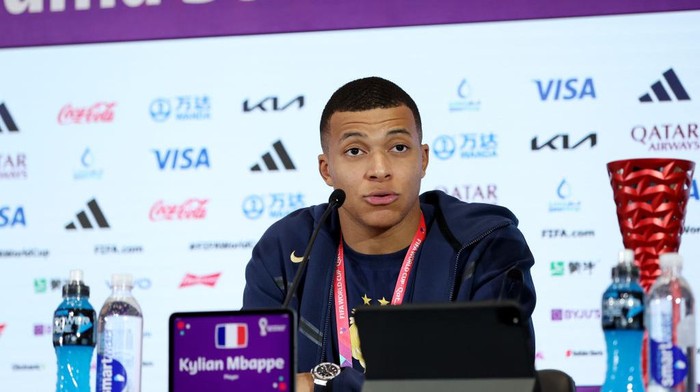 DOHA, QATAR - DECEMBER 04: Kylian Mbappe of France speaks to the media in the post match press conference after the teams victory during the FIFA World Cup Qatar 2022 Round of 16 match between France and Poland at Al Thumama Stadium on December 04, 2022 in Doha, Qatar. (Photo by Maja Hitij - FIFA/FIFA via Getty Images)
