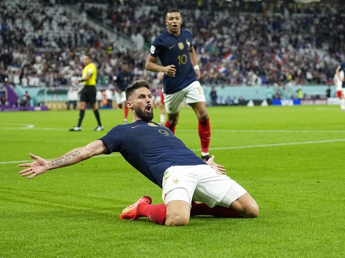 France's Olivier Giroud celebrates after scoring the opening goal during the World Cup round of 16 soccer match between France and Poland, at the Al Thumama Stadium in Doha, Qatar, Sunday, Dec. 4, 2022. (AP Photo/Ebrahim Noroozi)