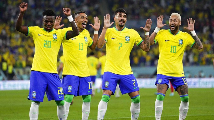Brazils Neymar, from right, celebrates with team mates Lucas Paqueta, Raphinha and Vinicius Junior after scoring his sides second goal during the World Cup round of 16 soccer match between Brazil and South Korea, at the Education City Stadium in Al Rayyan, Qatar, Monday, Dec. 5, 2022. (AP Photo/Manu Fernandez)