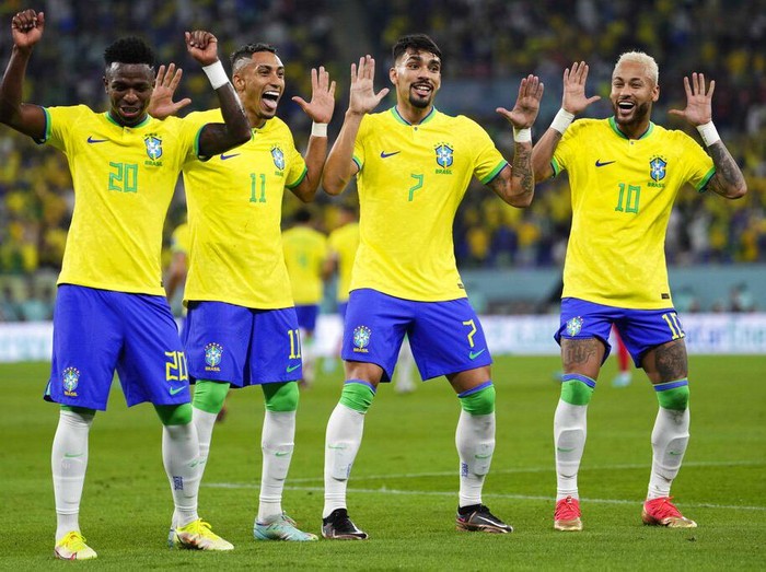 Brazil's Neymar, from right, celebrates with team mates Lucas Paqueta, Raphinha and Vinicius Junior after scoring his side's second goal during the World Cup round of 16 soccer match between Brazil and South Korea, at the Education City Stadium in Al Rayyan, Qatar, Monday, Dec. 5, 2022. (AP Photo/Manu Fernandez)