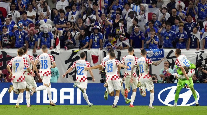 Croatia players celebrate their victory in the World Cup round of 16 soccer match between Japan and Croatia at the Al Janoub Stadium in Al Wakrah, Qatar, Monday, Dec. 5, 2022. (AP Photo/Eugene Hoshiko)