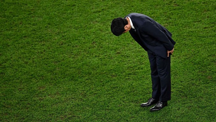 Japan's coach  Hajime Moriyasu bows after losing the Qatar 2022 World Cup round of 16 football match between Japan and Croatia at the Al-Janoub Stadium in Al-Wakrah, south of Doha on December 5, 2022. (Photo by Anne-Christine POUJOULAT / AFP) (Photo by ANNE-CHRISTINE POUJOULAT/AFP via Getty Images)