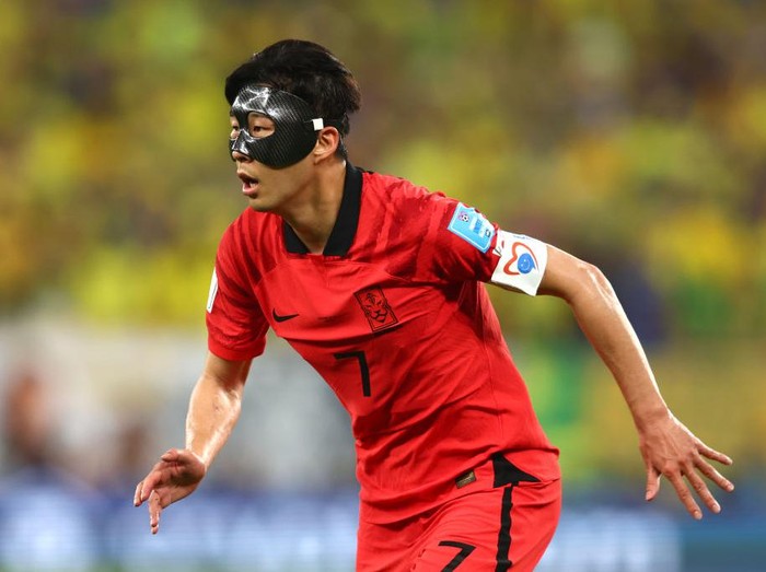 DOHA, QATAR - DECEMBER 05:  A dejected Son Heung-Min of Korea Republic reacts at full time during the FIFA World Cup Qatar 2022 Round of 16 match between Brazil and South Korea at Stadium 974 on December 5, 2022 in Doha, Qatar. (Photo by James Williamson - AMA/Getty Images)