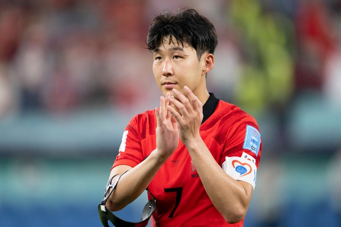 DOHA, QATAR - DECEMBER 05: Son Heung-Min of South Korea applauds the fans at the final whistle after the FIFA World Cup Qatar 2022 Round of 16 match between Brazil and South Korea at Stadium 974 on December 5, 2022 in Doha, Qatar. (Photo by Sebastian Frej/MB Media/Getty Images)