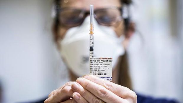 MELBOURNE, AUSTRALIA - JULY 20: Staff are seen preparing Pfizer vaccine doses inside the Melbourne Showgrounds COVID-19 Vaccination Centre on July 20, 2021 in Melbourne, Australia. Premier Daniel Andrews has announced a 7 day extension on the lockdown in Victoria, as the state continues to record new community COVID-19 cases and work to stop the spread of the highly infectious delta coronavirus strain in the community. (Photo by Daniel Pockett/Getty Images)