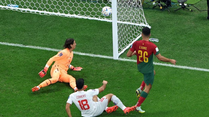TOPSHOT - Portugals forward #26 Goncalo Ramos scores his teams third goal during the Qatar 2022 World Cup round of 16 football match between Portugal and Switzerland at Lusail Stadium in Lusail, north of Doha on December 6, 2022. (Photo by Giuseppe CACACE / AFP) (Photo by GIUSEPPE CACACE/AFP via Getty Images)