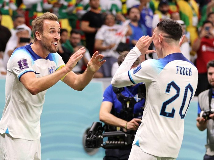 AL KHOR, QATAR - DECEMBER 04: Harry Kane of England celebrates after scoring the team's second goal during the FIFA World Cup Qatar 2022 Round of 16 match between England and Senegal at Al Bayt Stadium on December 04, 2022 in Al Khor, Qatar. (Photo by Clive Brunskill/Getty Images)