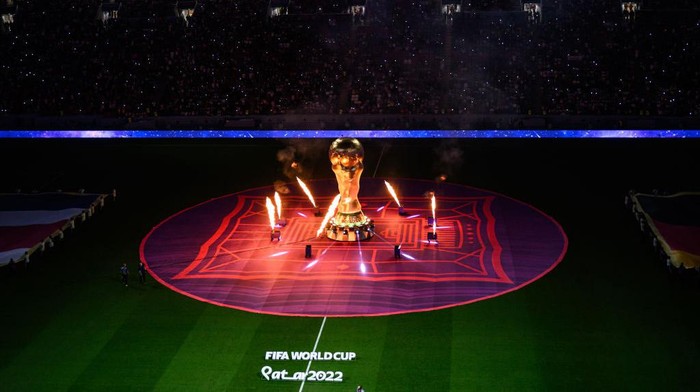 AL KHOR, QATAR - DECEMBER 01: General view of the pre match ceremony with the flags and a copy of the trophy of the World Cup with firework prior to the FIFA World Cup Qatar 2022 Group E match between Costa Rica and Germany at Al Bayt Stadium on December 01, 2022 in Al Khor, Qatar. (Photo by Markus Gilliar - GES Sportfoto/Getty Images)