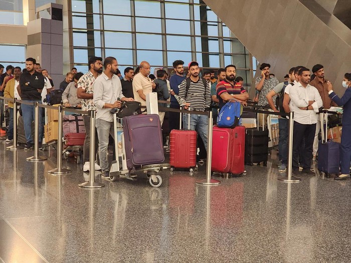 DOHA, QATAR - DECEMBER 07: Football fans arrive at the Hamad international Airport ahead of the 2022 FIFA World Cup, prior to the finals at Doha, Qatar on December 07, 2022.
 (Photo by Ashraf Amra/Anadolu Agency via Getty Images)