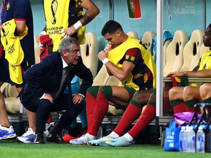 LUSAIL CITY, QATAR - DECEMBER 06: Fernando Santos, Head Coach of Portugal, speaks with Cristiano Ronaldo before a substitution during the FIFA World Cup Qatar 2022 Round of 16 match between Portugal and Switzerland at Lusail Stadium on December 06, 2022 in Lusail City, Qatar. (Photo by Justin Setterfield/Getty Images)