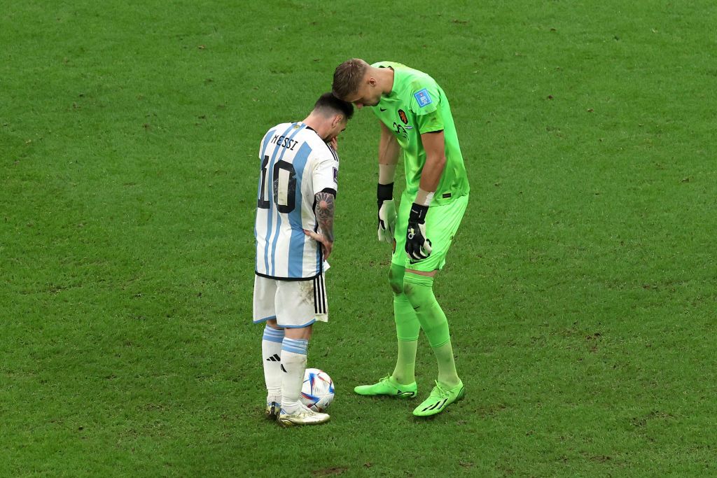 LUSAIL CITY, QATAR - DECEMBER 09: Lionel Messi of Argentina is talked by Andries Noppert of Netherlands before taking a penalty during the FIFA World Cup Qatar 2022 quarter final match between Netherlands and Argentina at Lusail Stadium on December 09, 2022 in Lusail City, Qatar. (Photo by Alexander Hassenstein/Getty Images)
