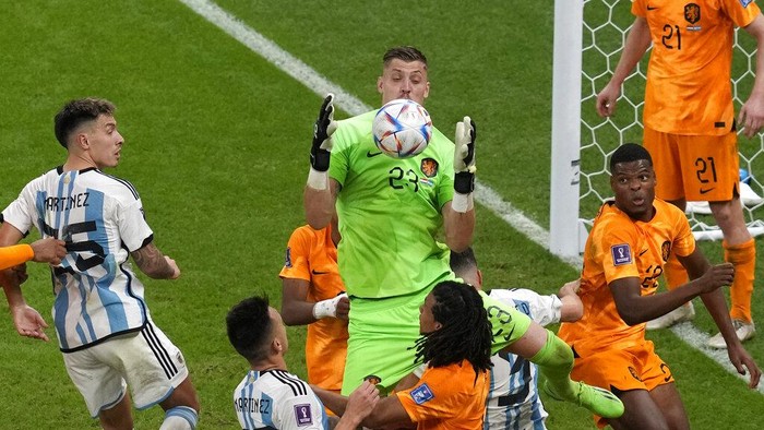 Goalkeeper Andries Noppert of the Netherlands makes a save during the World Cup quarterfinal soccer match between the Netherlands and Argentina, at the Lusail Stadium in Lusail, Qatar, Saturday, Dec. 10, 2022. (AP Photo/Thanassis Stavrakis)