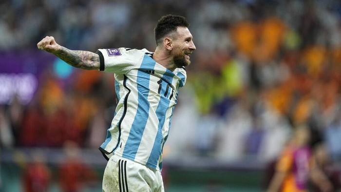 Argentinas Lionel Messi celebrates at the end of the World Cup quarterfinal soccer match between the Netherlands and Argentina, at the Lusail Stadium in Lusail, Qatar, Saturday, Dec. 10, 2022. Argentina defeated the Netherlands 4-3 in a penalty shootout after the match ended tied 2-2.(AP Photo/Jorge Saenz)