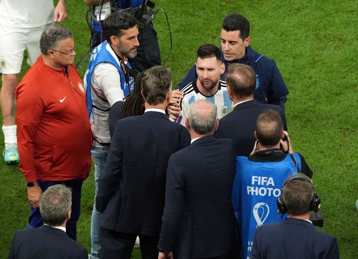 Argentinas Lionel Messi with Netherlands manager Louis van Gaal following the FIFA World Cup Quarter-Final match at the Lusail Stadium in Lusail, Qatar. Picture date: Friday December 9, 2022. (Photo by Peter Byrne/PA Images via Getty Images)