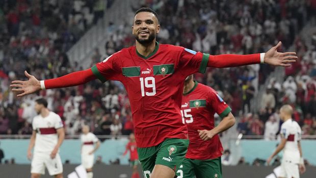 Morocco's Youssef En-Nesyri celebrates after scoring his side's first goal during the World Cup quarterfinal soccer match between Morocco and Portugal, at Al Thumama Stadium in Doha, Qatar, Saturday, Dec. 10, 2022. (AP Photo/Martin Meissner)