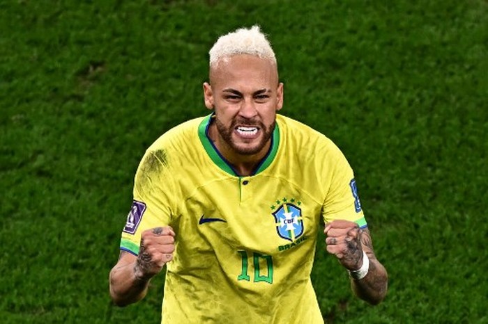Brazils forward #10 Neymar celebrates scoring his teams first goal during the Qatar 2022 World Cup quarter-final football match between Croatia and Brazil at Education City Stadium in Al-Rayyan, west of Doha, on December 9, 2022. (Photo by Anne-Christine POUJOULAT / AFP)