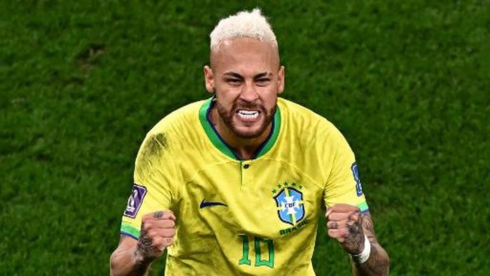 Brazils forward #10 Neymar celebrates scoring his teams first goal during the Qatar 2022 World Cup quarter-final football match between Croatia and Brazil at Education City Stadium in Al-Rayyan, west of Doha, on December 9, 2022. (Photo by Anne-Christine POUJOULAT / AFP)