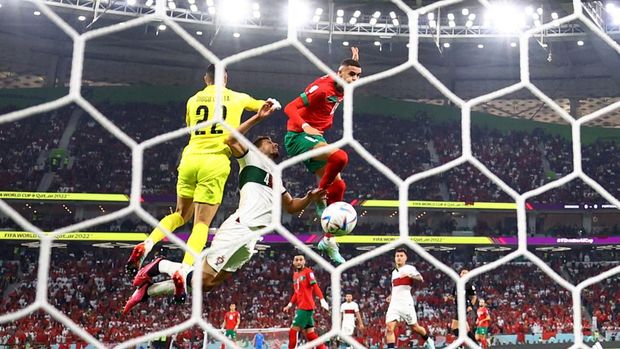 Soccer Football - FIFA World Cup Qatar 2022 - Quarter Final - Morocco v Portugal - Al Thumama Stadium, Doha, Qatar - December 10, 2022 Morocco's Youssef En-Nesyri scores their first goal REUTERS/Carl Recine