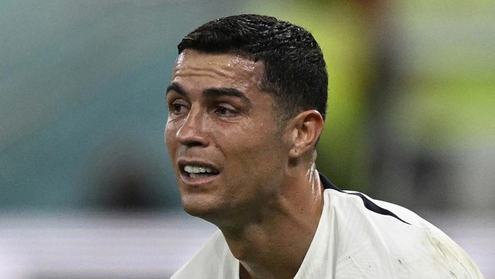 Portugals forward #07 Cristiano Ronaldo reacts after his team lost the Qatar 2022 World Cup quarter-final football match between Morocco and Portugal at the Al-Thumama Stadium in Doha on December 10, 2022. (Photo by PATRICIA DE MELO MOREIRA / AFP) (Photo by PATRICIA DE MELO MOREIRA/AFP via Getty Images