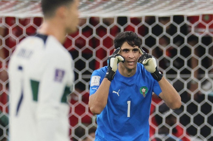 Morocco's goalkeeper #01 Yassine Bounou reacts during the Qatar 2022 World Cup quarter-final football match between Morocco and Portugal at the Al-Thumama Stadium in Doha on December 10, 2022. (Photo by KARIM JAAFAR / AFP) (Photo by KARIM JAAFAR/AFP via Getty Images)