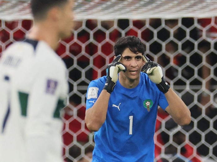 Morocco's goalkeeper #01 Yassine Bounou reacts during the Qatar 2022 World Cup quarter-final football match between Morocco and Portugal at the Al-Thumama Stadium in Doha on December 10, 2022. (Photo by KARIM JAAFAR / AFP) (Photo by KARIM JAAFAR/AFP via Getty Images)
