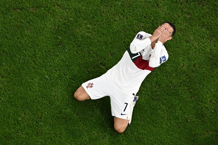 Portugals forward #07 Cristiano Ronaldo reacts during the Qatar 2022 World Cup quarter-final football match between Morocco and Portugal at the Al-Thumama Stadium in Doha on December 10, 2022. (Photo by MANAN VATSYAYANA / AFP) (Photo by MANAN VATSYAYANA/AFP via Getty Images)