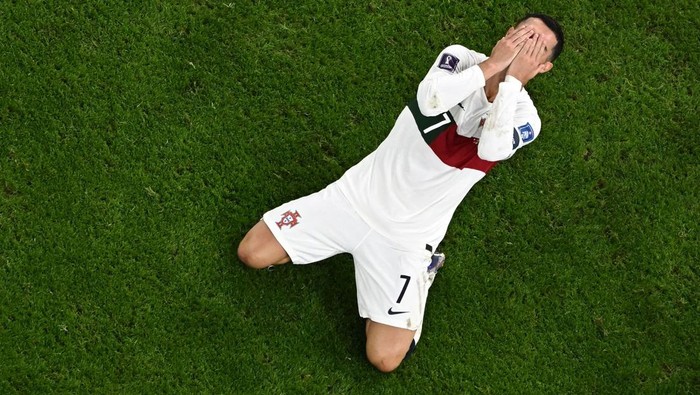 Portugals forward #07 Cristiano Ronaldo reacts during the Qatar 2022 World Cup quarter-final football match between Morocco and Portugal at the Al-Thumama Stadium in Doha on December 10, 2022. (Photo by MANAN VATSYAYANA / AFP) (Photo by MANAN VATSYAYANA/AFP via Getty Images)