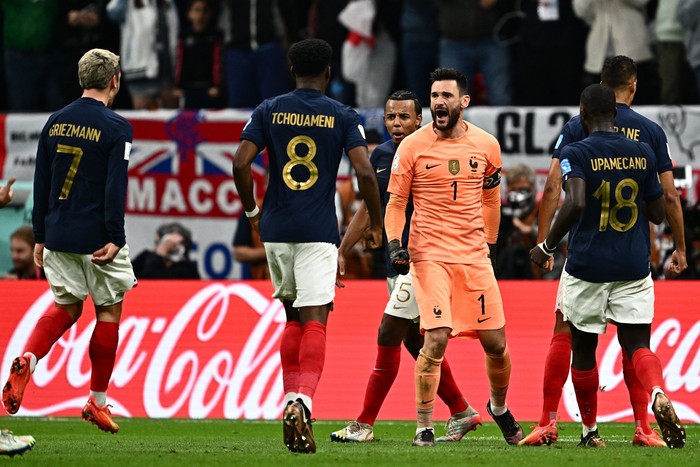 Frances goalkeeper #01 Hugo Lloris (C) celebrates with teammates after he saved a penalty kick during the Qatar 2022 World Cup quarter-final football match between England and France at the Al-Bayt Stadium in Al Khor, north of Doha, on December 10, 2022. (Photo by GABRIEL BOUYS / AFP) (Photo by GABRIEL BOUYS/AFP via Getty Images)