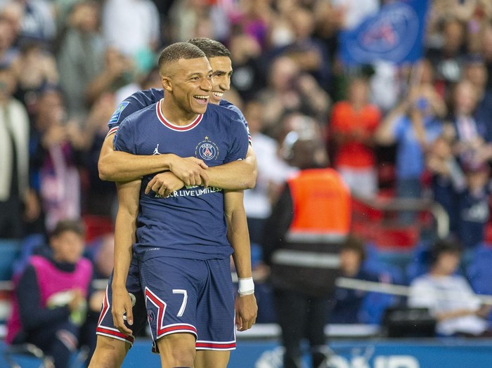 PARIS, FRANCE - May 21:  Kylian Mbappé #7 of Paris Saint-Germain is congratulated by Achraf Hakimi #2 of Paris Saint-Germain after completing his hat trick of goals during the Paris Saint-Germain Vs Metz, French Ligue 1 regular season match at Parc des Princes on May 21st 2022 in Paris, France (Photo by Tim Clayton/Corbis via Getty Images)