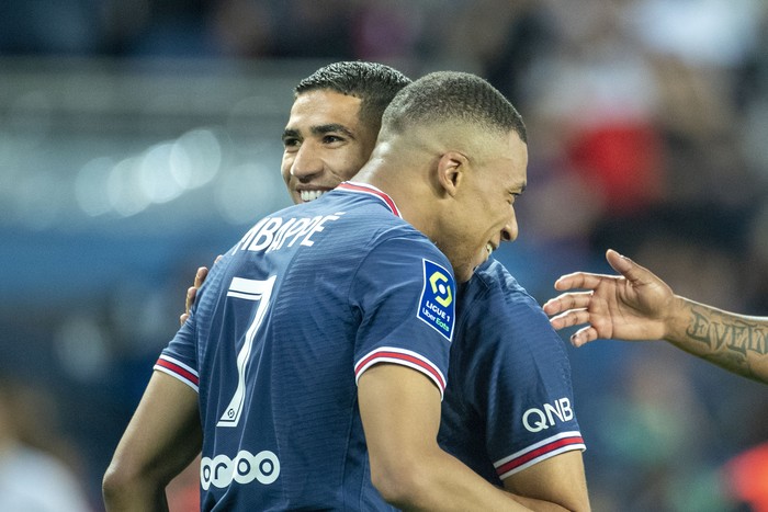PARIS, FRANCE - May 21:  Kylian Mbappé #7 of Paris Saint-Germain is congratulated by Achraf Hakimi #2 of Paris Saint-Germain after completing his hat trick of goals during the Paris Saint-Germain Vs Metz, French Ligue 1 regular season match at Parc des Princes on May 21st 2022 in Paris, France (Photo by Tim Clayton/Corbis via Getty Images)