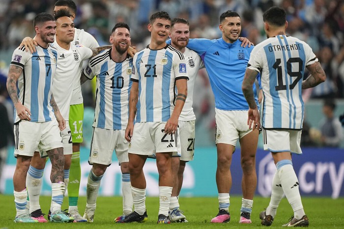Argentinas Lionel Messi, 3rd left, celebrates with team mates after the World Cup semifinal soccer match between Argentina and Croatia at the Lusail Stadium in Lusail, Qatar, Tuesday, Dec. 13, 2022. (AP Photo/Martin Meissner)