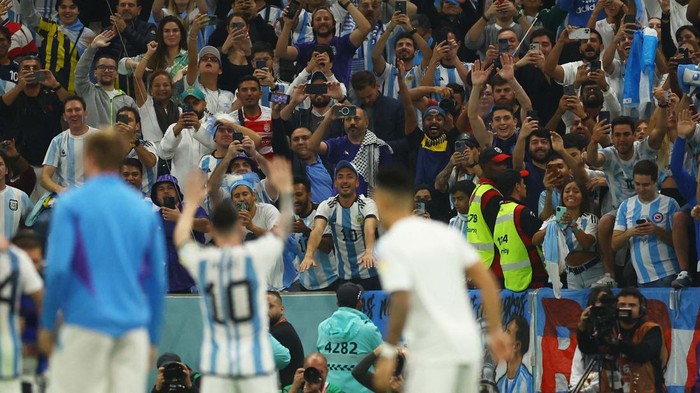 Soccer Football - FIFA World Cup Qatar 2022 - Semi Final - Argentina v Croatia - Lusail Stadium, Lusail, Qatar - December 13, 2022
Argentinas Lionel Messi celebrates with fans after the match REUTERS/Peter Cziborra