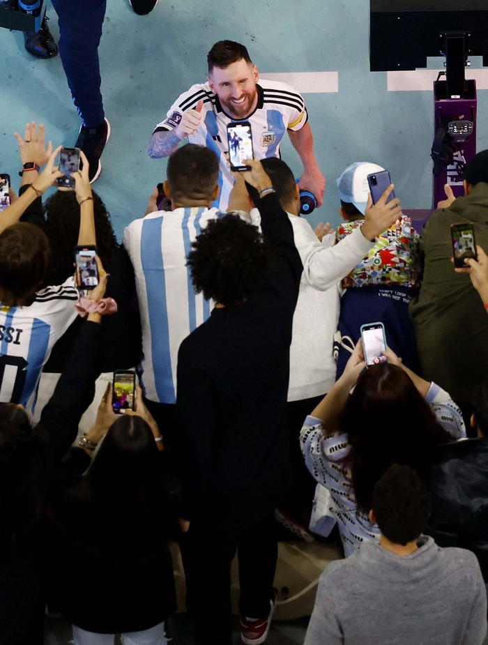 Soccer Football - FIFA World Cup Qatar 2022 - Semi Final - Argentina v Croatia - Lusail Stadium, Lusail, Qatar - December 13, 2022
Argentina's Lionel Messi celebrates with fans after the match REUTERS/Peter Cziborra