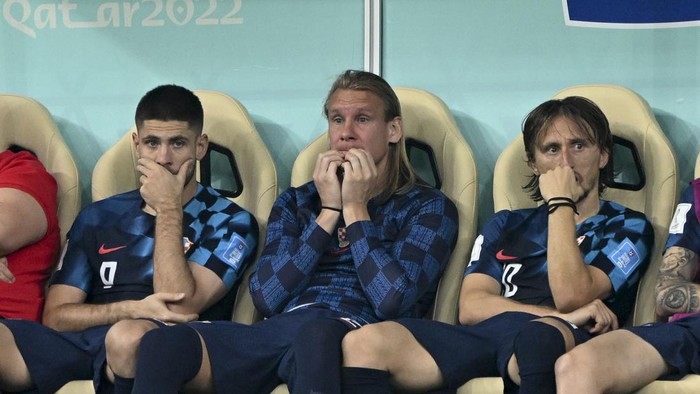 LUSAIL CITY, QATAR - DECEMBER 13: Luka Modric (R) of Croatia gets upset at the end of FIFA World Cup Qatar 2022 Semi-Final match between Argentina and Croatia at Lusail Stadium on December 13, 2022, in Lusail City, Qatar. (Photo by Ercin Erturk/Anadolu Agency via Getty Images)