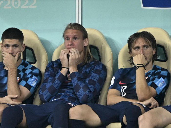 LUSAIL CITY, QATAR - DECEMBER 13: Luka Modric (R) of Croatia gets upset at the end of FIFA World Cup Qatar 2022 Semi-Final match between Argentina and Croatia at Lusail Stadium on December 13, 2022, in Lusail City, Qatar. (Photo by Ercin Erturk/Anadolu Agency via Getty Images)