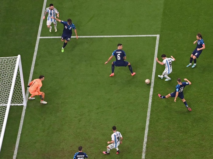 Argentina's forward #09 Julian Alvarez (3R) scores his team's third goal during the Qatar 2022 World Cup football semi-final match between Argentina and Croatia at Lusail Stadium in Lusail, north of Doha on December 13, 2022. (Photo by Anne-Christine POUJOULAT / AFP) (Photo by ANNE-CHRISTINE POUJOULAT/AFP via Getty Images)