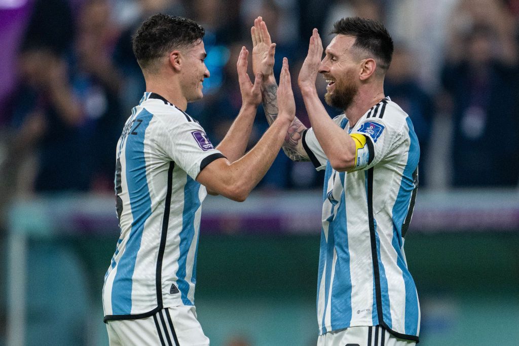 LUSAIL CITY, QATAR - DECEMBER 13:  Julian Alvarez celebrates with Lionel Messi of Argentina after scoring the team's second goal during the FIFA World Cup Qatar 2022 semi final match between Argentina and Croatia at Lusail Stadium on December 13, 2022 in Lusail City, Qatar. (Photo by Michael Regan - FIFA/FIFA via Getty Images)
