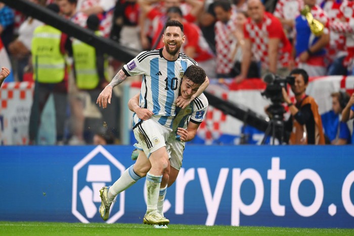 LUSAIL CITY, QATAR - DECEMBER 13:  Julian Alvarez celebrates with Lionel Messi of Argentina after scoring the teams second goal during the FIFA World Cup Qatar 2022 semi final match between Argentina and Croatia at Lusail Stadium on December 13, 2022 in Lusail City, Qatar. (Photo by Michael Regan - FIFA/FIFA via Getty Images)