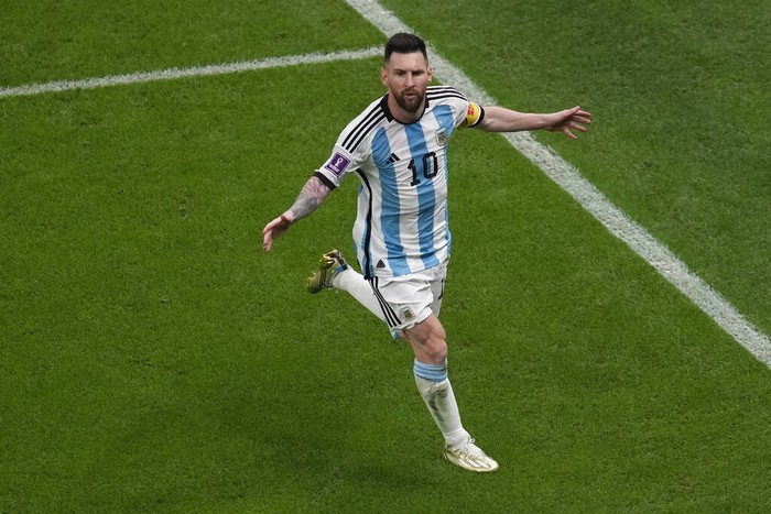 Argentina's Lionel Messi celebrates scoring his side's opening goal from the penalty spot during the World Cup semifinal soccer match between Argentina and Croatia at the Lusail Stadium in Lusail, Qatar, Tuesday, Dec. 13, 2022. (AP Photo/Thanassis Stavrakis)