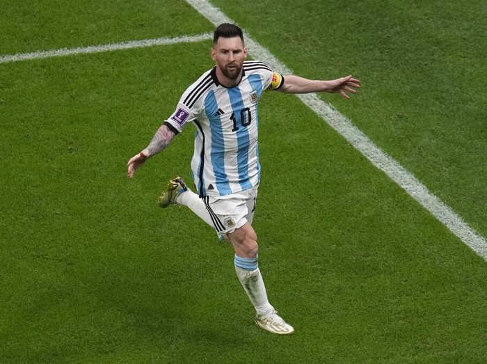 Argentina's Lionel Messi celebrates scoring his side's opening goal from the penalty spot during the World Cup semifinal soccer match between Argentina and Croatia at the Lusail Stadium in Lusail, Qatar, Tuesday, Dec. 13, 2022. (AP Photo/Thanassis Stavrakis)