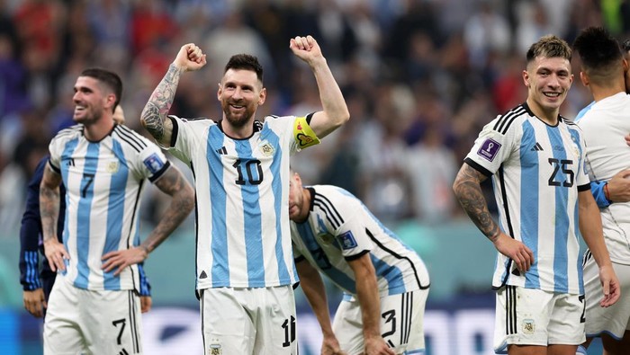 LUSAIL CITY, QATAR - DECEMBER 13: Lionel Messi of Argentina celebrates the teams 3-0 victory in the FIFA World Cup Qatar 2022 semi final match between Argentina and Croatia at Lusail Stadium on December 13, 2022 in Lusail City, Qatar. (Photo by Clive Brunskill/Getty Images)