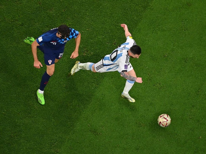 LUSAIL CITY, QATAR - DECEMBER 13: Lionel Messi of Argentina controls the ball against Josko Gvardiol of Croatia during the FIFA World Cup Qatar 2022 semi final match between Argentina and Croatia at Lusail Stadium on December 13, 2022 in Lusail City, Qatar. (Photo by Dan Mullan/Getty Images)