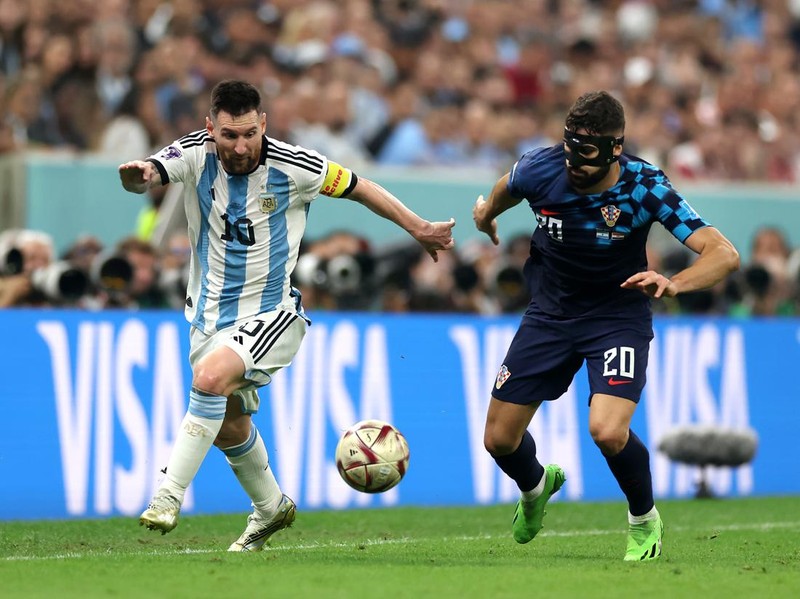 LUSAIL CITY, QATAR - DECEMBER 13: Lionel Messi of Argentina battles for possession with Josko Gvardiol of Croatia during the FIFA World Cup Qatar 2022 semi final match between Argentina and Croatia at Lusail Stadium on December 13, 2022 in Lusail City, Qatar. (Photo by Lars Baron/Getty Images)