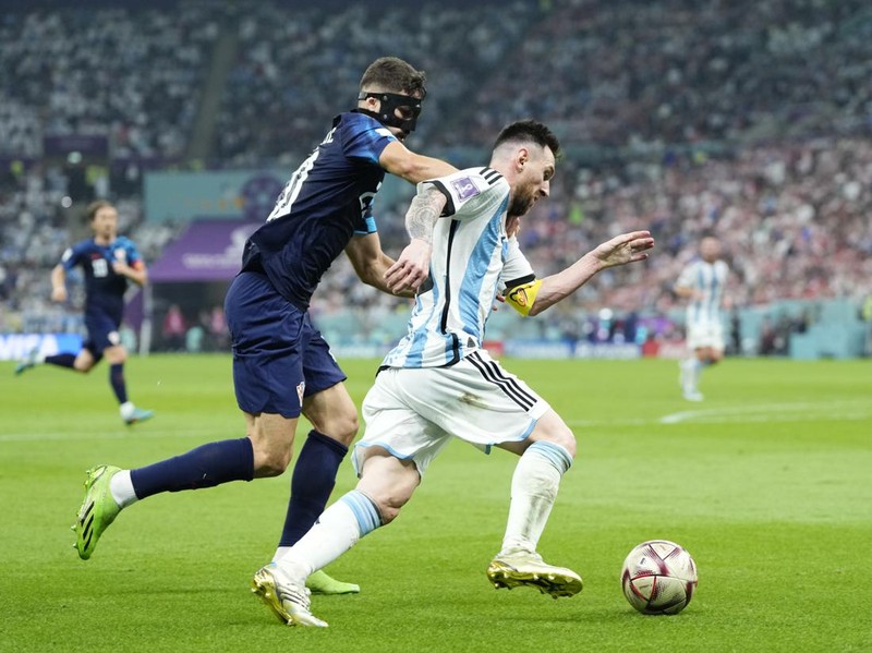 Lionel Messi right winger of Argentina and Paris Saint-Germain and Josko Gvardiol centre-back of Croatia and RB Leipzig compete for the ball during the FIFA World Cup Qatar 2022 semi final match between Argentina and Croatia at Lusail Stadium on December 13, 2022 in Lusail City, Qatar. (Photo by Jose Breton/Pics Action/NurPhoto via Getty Images)