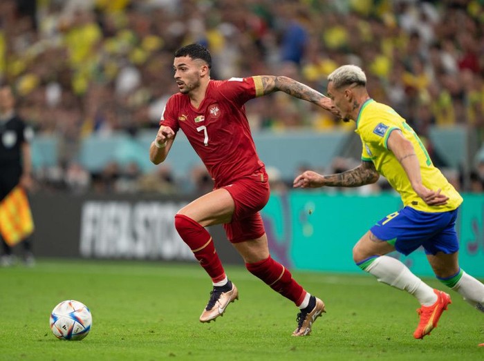 DOHA, QATAR - NOVEMBER 24: Nemanja Radonji #7 of Serbia dribbles the ball during a FIFA World Cup Qatar 2022 Group G match between Serbia and Brazil at Lusail Stadium on November 24, 2022 in Doha, Qatar. (Photo by John Todd/ISI Photos/Getty Images)