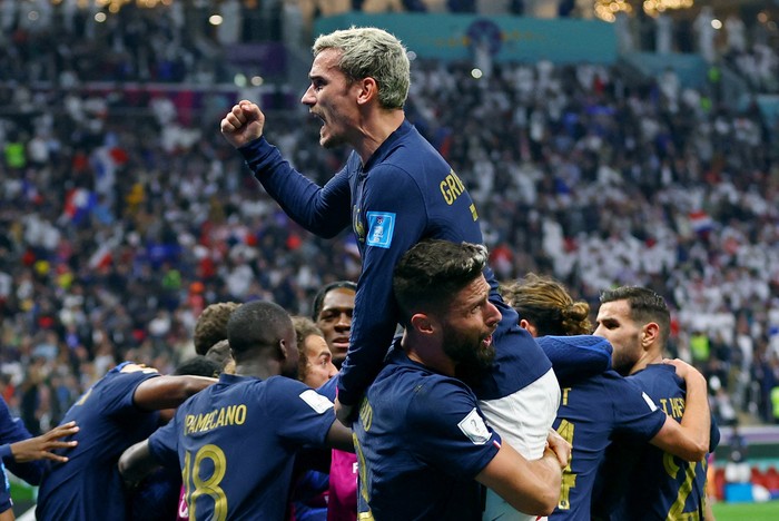 Soccer Football - FIFA World Cup Qatar 2022 - Quarter Final - England v France - Al Bayt Stadium, Al Khor, Qatar - December 10, 2022 Frances Olivier Giroud celebrates scoring their second goal with Antoine Griezmann and teammates REUTERS/Matthew Childs